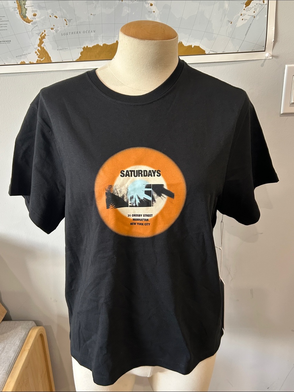 Saturdays New York City Black Tee with Orange Circle Graphic